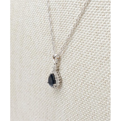 27 - A hallmarked 9ct white gold pendant set with diamond and sapphire on a 9ct gold chain, gross weight ... 