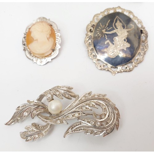 43 - A hallmarked silver cameo brooch, a silver Niello work brooch, one other brooch and a silver pendant... 