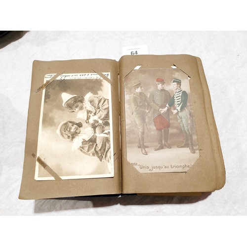 64 - A postcard album. UK shipping £14.