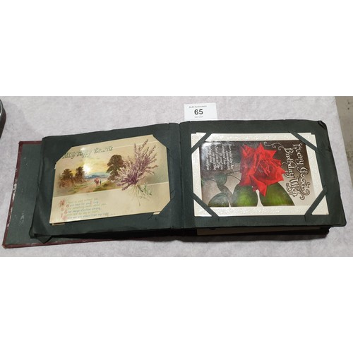 65 - A postcard album. UK shipping £14.