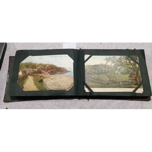 65 - A postcard album. UK shipping £14.