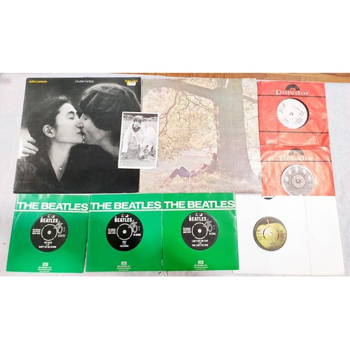 87 - A selection of Beatles and John Lennon LPs and singles. UK shipping £14.