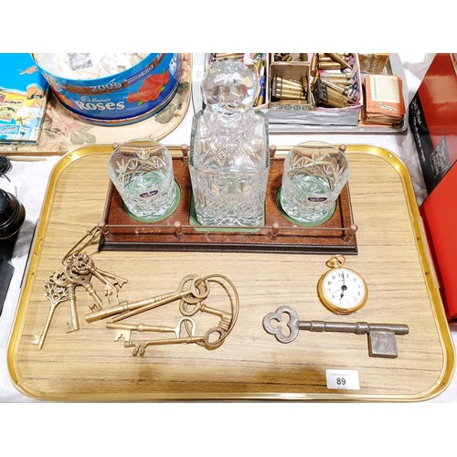 89 - A Royal Doulton cut crystal decanter with matching tumblers on a wooden stand together with assorted... 