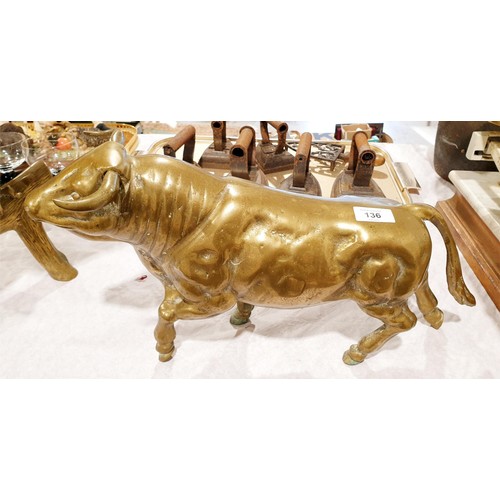 136 - A vintage brass model of a bull, length 20