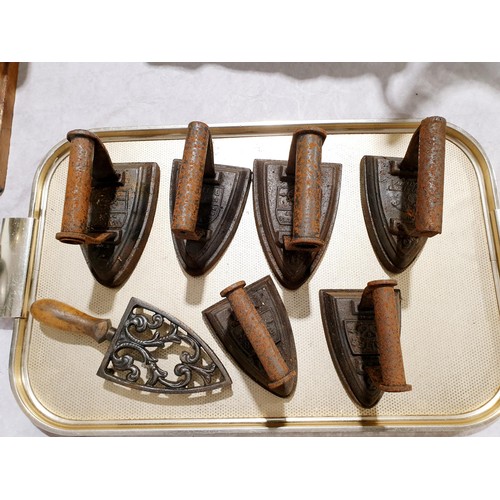 159 - Six flat irons and a cast iron trivet. No shipping. Arrange collection or your own packer and shippe... 