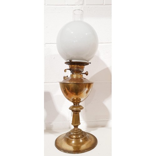 238 - An antique brass oil lamp, height 23