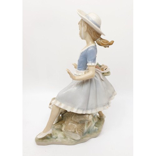 243 - A Lladro figure of a girl being chased by a goose, height 8