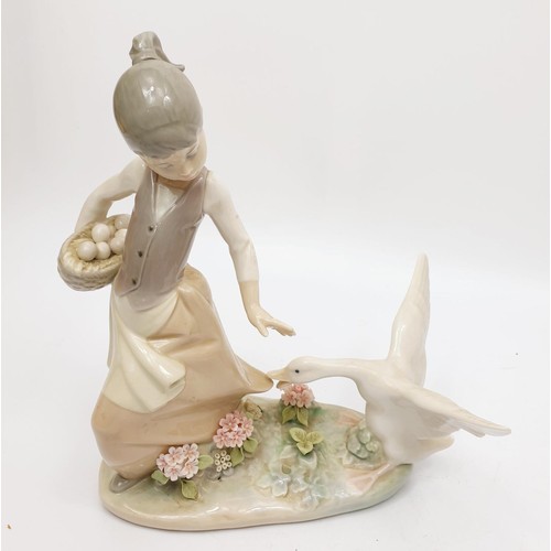 243 - A Lladro figure of a girl being chased by a goose, height 8