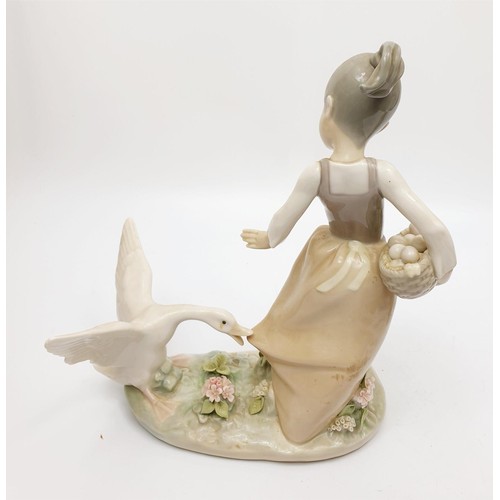 243 - A Lladro figure of a girl being chased by a goose, height 8