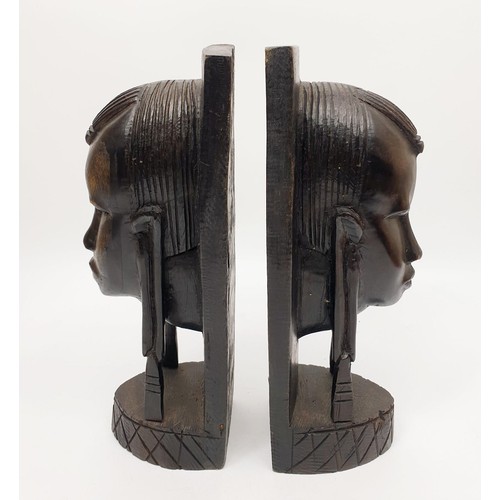 246 - A pair of carved wooden tribal bookends, height 9.75