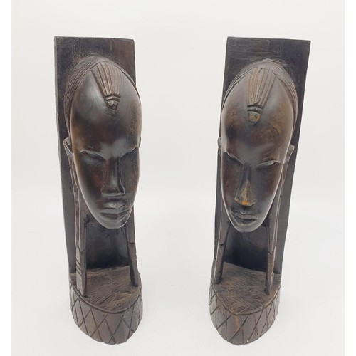 246 - A pair of carved wooden tribal bookends, height 9.75