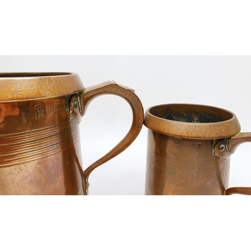 249 - Two Edwardian brass court tankards one a quart the other a pint by Farrow & Jackson, the tallest 6