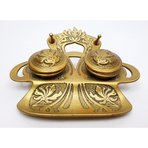 250 - An early 20th century brass ink well, width 6.25