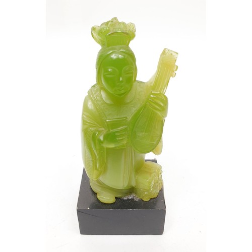 256 - A resin figure of a Chinese musician, height 4