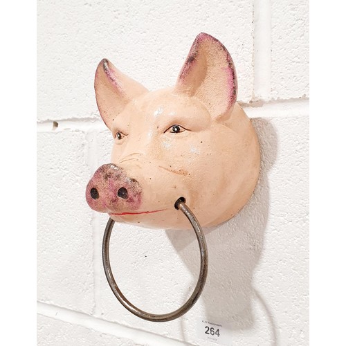 264 - A cast iron wall hanging hook in the form of a pig's head with a ring, length 8.75