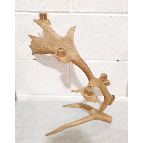 267 - A candle holder made from antlers, height 19