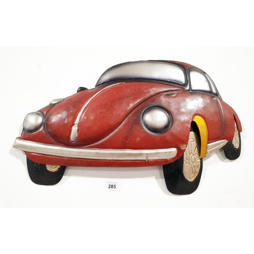 285 - A tin plate Volkswagen Beetle wall decoration, width 20