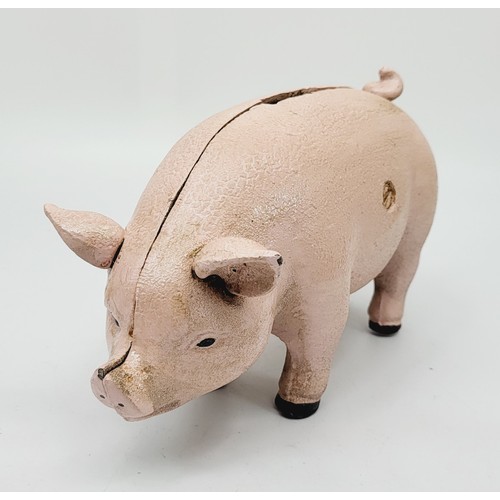 279 - A cast iron pig money box. UK shipping £14.