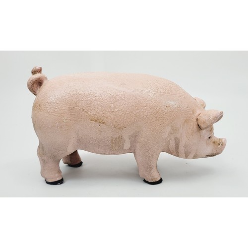 279 - A cast iron pig money box. UK shipping £14.