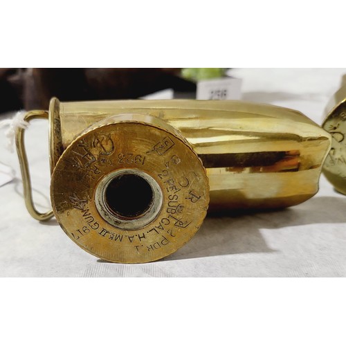 254 - Two scoops made from brass shells, one using two WWI shells dated 1918 and 1916, length 4