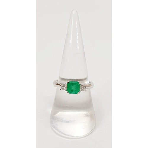 7 - A hallmarked 18ct white gold emerald and diamond three stone dress ring, gross weight 3.5g, size O/P... 