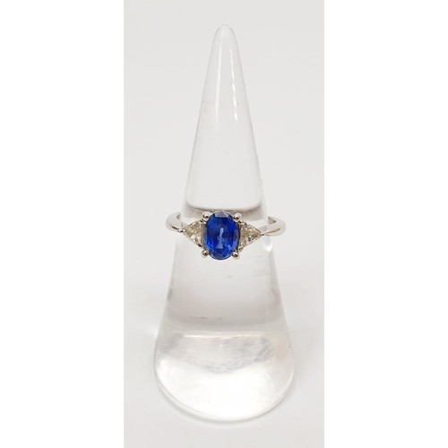 11 - A hallmarked 18ct white gold sapphire and diamond three stone ring, gross weight 3.3g, size K/L. UK ... 