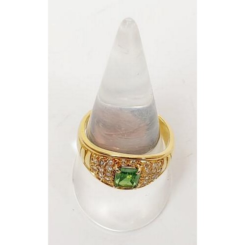 12 - A hallmarked 18ct gold emerald and diamond dress ring, gross weight 7.7g, size T/U. UK shipping £14.