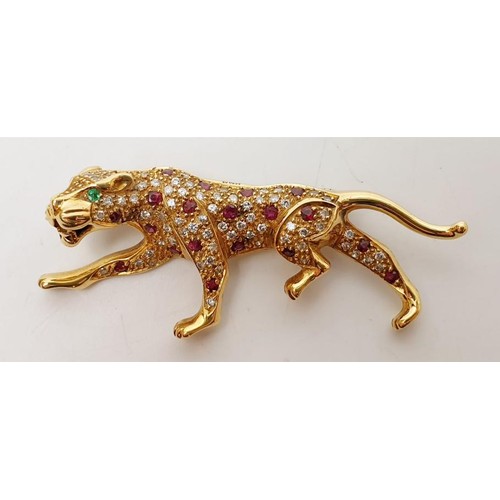 15 - A hallmarked 18ct gold brooch in the form of a panther set with diamond, ruby and emerald, length 2