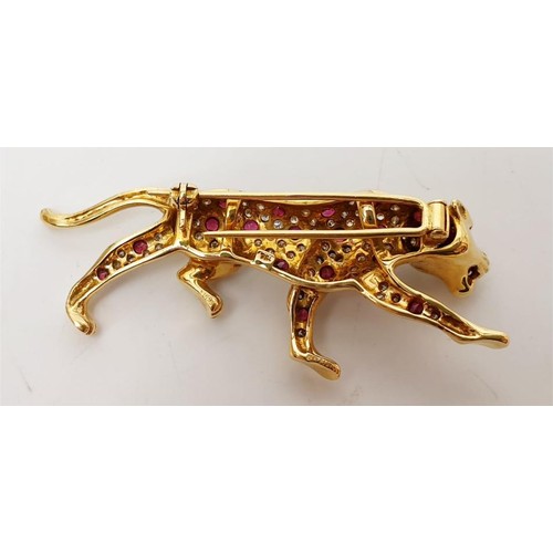 15 - A hallmarked 18ct gold brooch in the form of a panther set with diamond, ruby and emerald, length 2