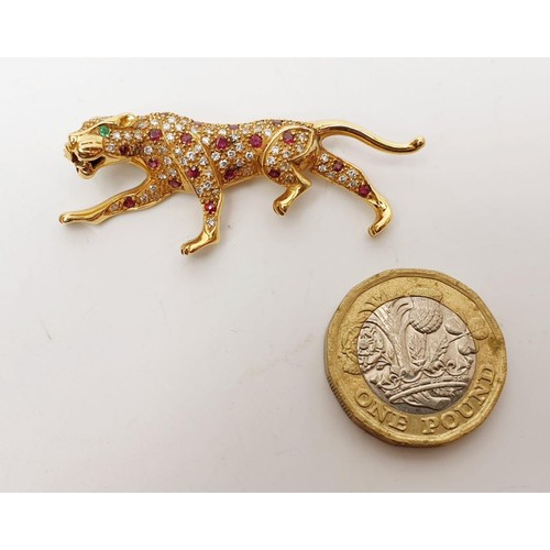 15 - A hallmarked 18ct gold brooch in the form of a panther set with diamond, ruby and emerald, length 2