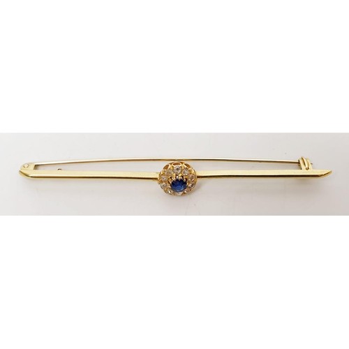 16 - A yellow metal diamond and sapphire cluster bar brooch, length 3