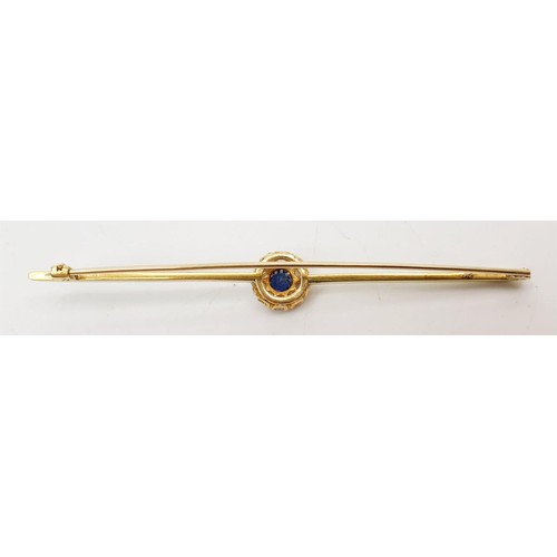 16 - A yellow metal diamond and sapphire cluster bar brooch, length 3