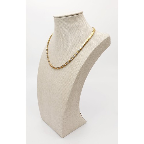 20 - An 18ct white and yellow gold diamond set necklace, length 16.5