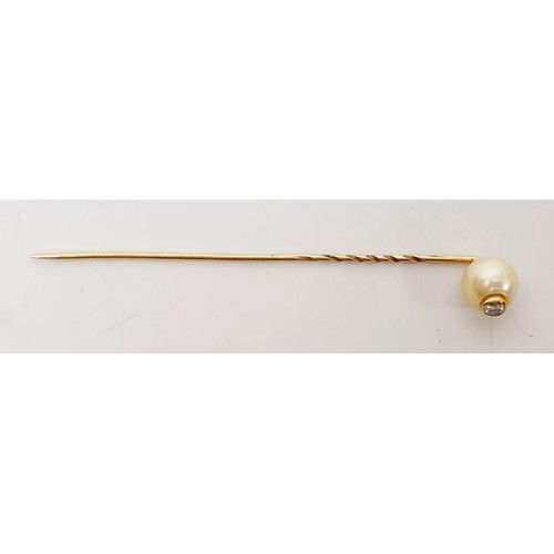 26 - A diamond set cultured pearl stick pin. UK shipping £14.