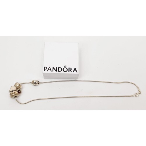 28 - A boxed silver Pandora necklace with silver and white metal charms, gross weight 20g. UK shipping £1... 