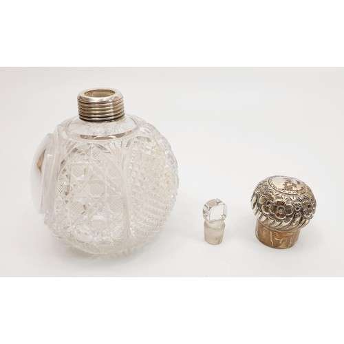 35 - A cut glass scent bottle with a white metal top, height 5.75