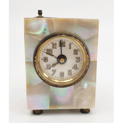 53 - A vintage alarm clock veneered with mother of pearl, A/F, height 3