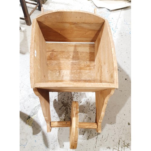 182 - A wooden planter in the form of a wheelbarrow, length 42