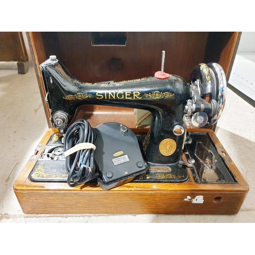 226 - A vintage Singer sewing machine. No shipping. Arrange collection or your own packer and shipper, ple... 