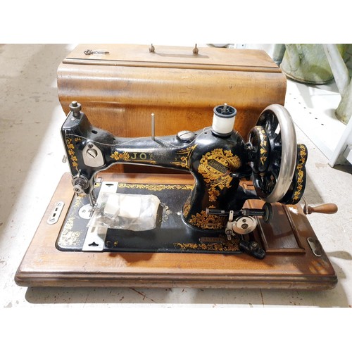 228 - A vintage Singer sewing machine. No shipping. Arrange collection or your own packer and shipper, ple... 