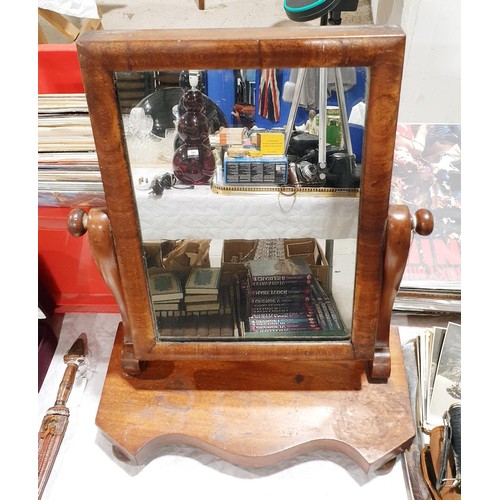 124 - A 19th century mahogany toilet mirror, height 18.5