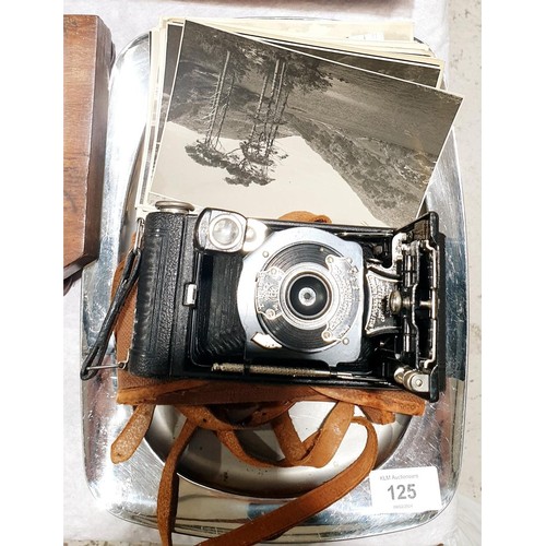 125 - A vintage No. 1 Kodak pocket camera together with photographs. UK shipping £14.