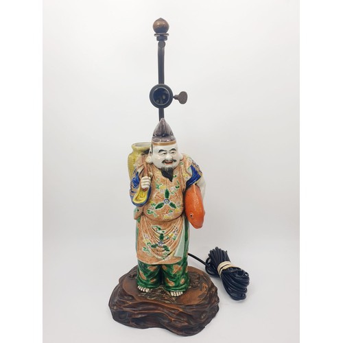 290 - A vintage table lamp with a Chinese ceramic figure, height 18