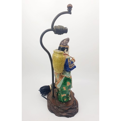 290 - A vintage table lamp with a Chinese ceramic figure, height 18