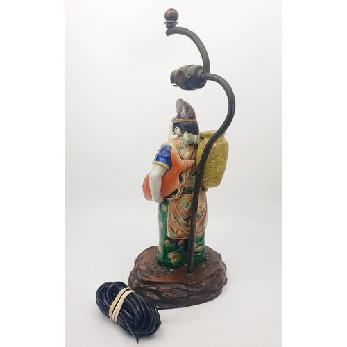 290 - A vintage table lamp with a Chinese ceramic figure, height 18