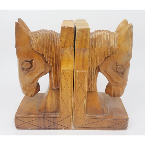 293 - A pair of carved wooden horse bookends, height 8.25