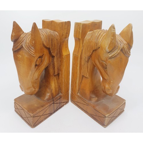 293 - A pair of carved wooden horse bookends, height 8.25