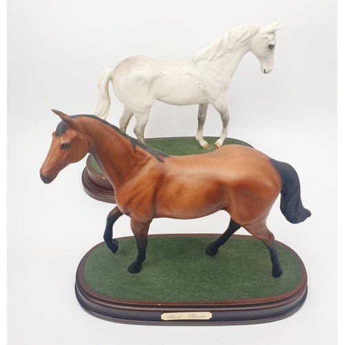 295 - Two Royal Doulton model horses: Red Rum and Desert Orchid, height 9