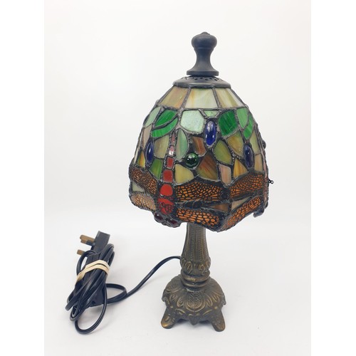 305 - A Tiffany style table lamp with dragonfly motifs and a metal base, height 12