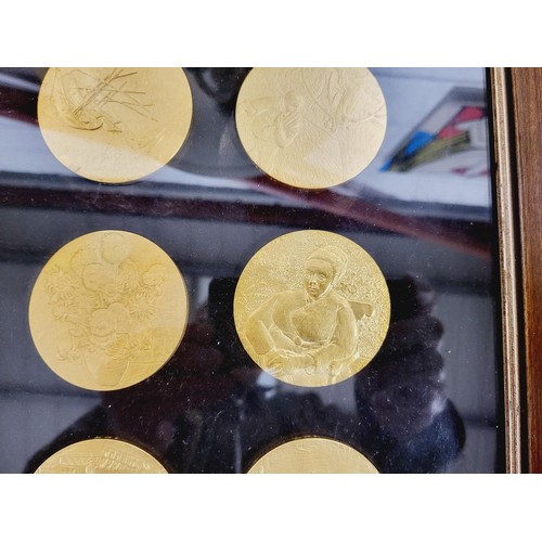 315 - A framed collection of twelve The Van Gogh medals with certificates, diameter 2.5